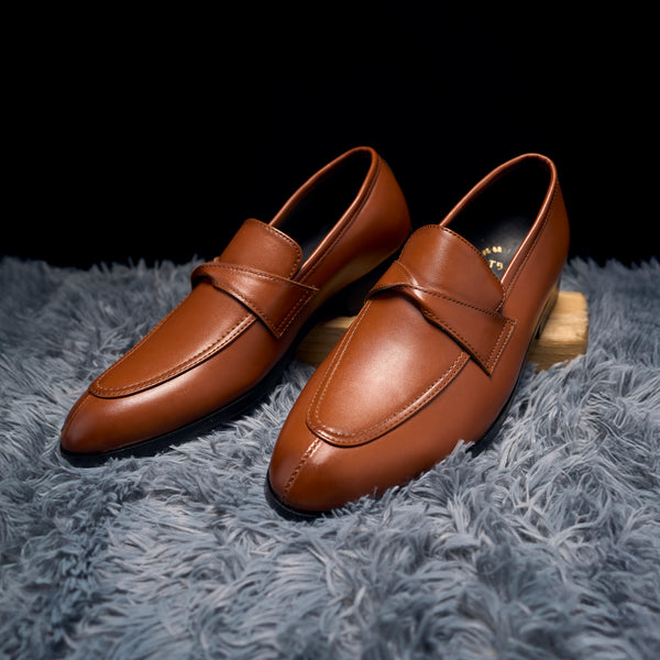 The Brat Army Derby Tan Twisted Strap Loafers.