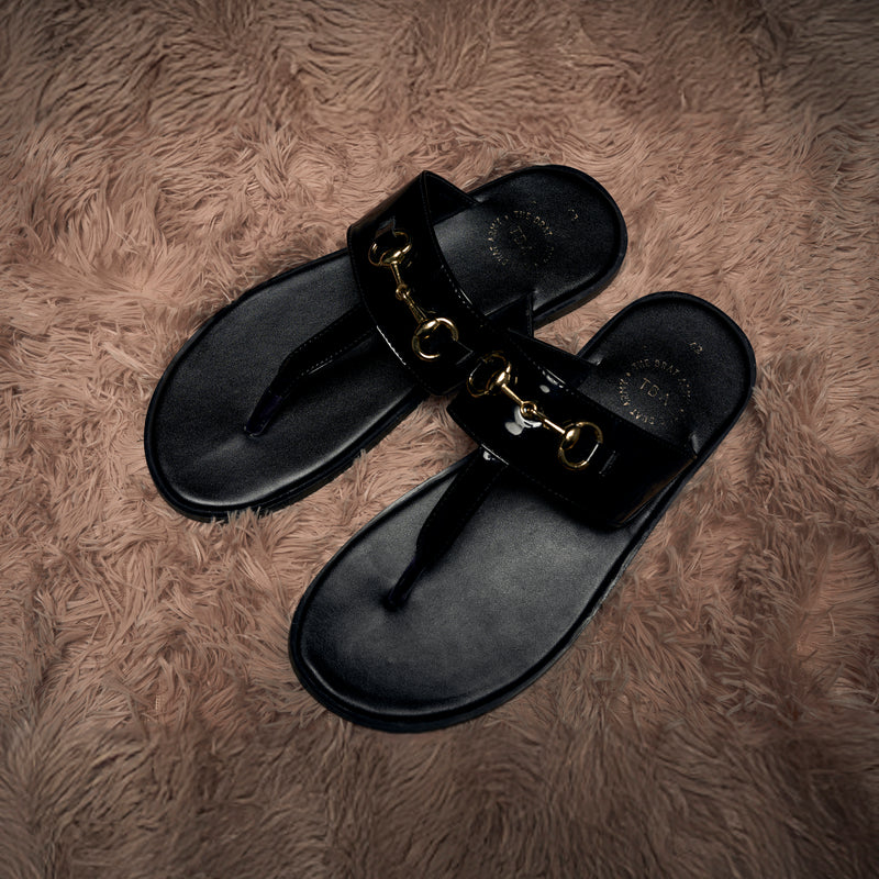 The Brat Army Patent Black Horsebit Sandals with Grip Sole and Buckle Detail